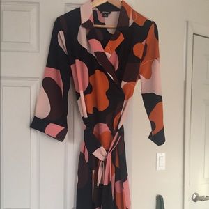 Abstract print belted wrap dress